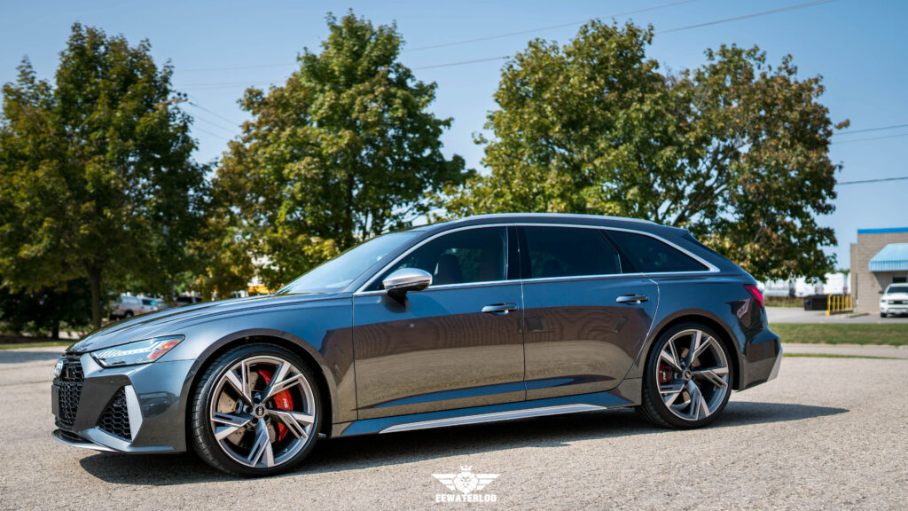 Angled side view of a grey Audi RS6 Avant showing its glossy paint finish and XPEL XR Plus tinted windows.