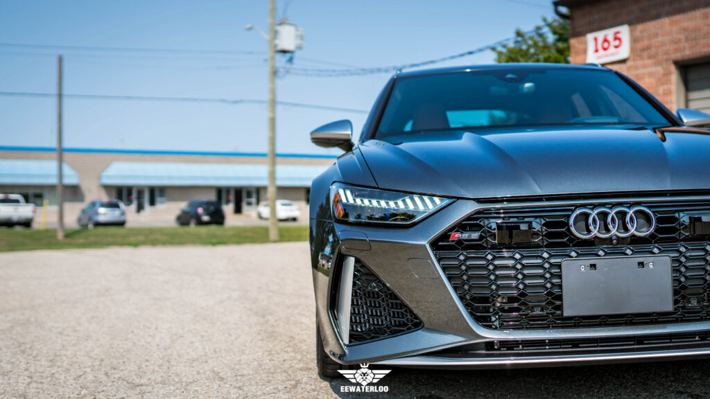 Close-up of the Audi RS6 Avant front end, showing the hood, headlight and grille after front-end PPF installation.