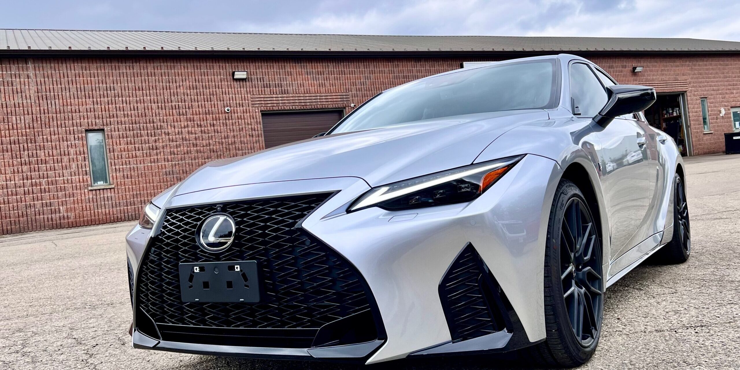 Front three-quarter view of a silver Lexus IS with an XPEL Ultimate Plus front end PPF package at EEwaterloo Auto Detailing in Waterloo.
