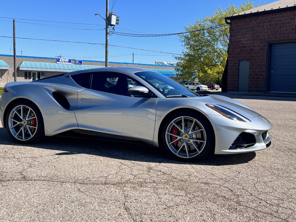 Side view of a silver Lotus Emira protected with full body XPEL Ultimate Plus paint protection film.