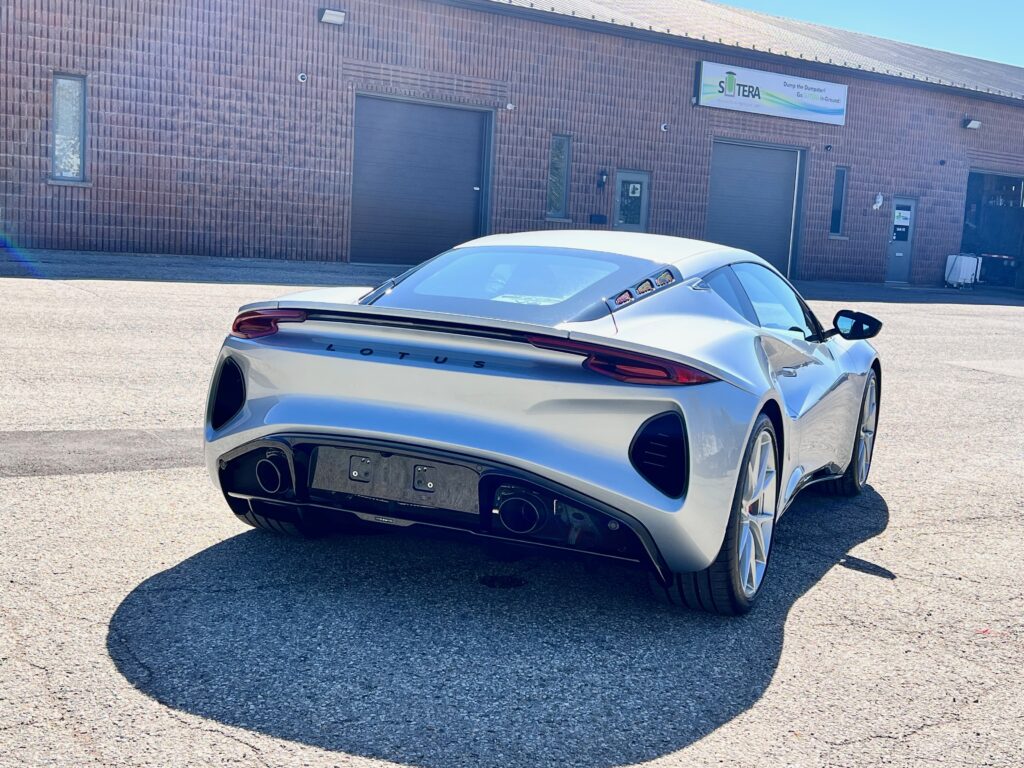 Rear three-quarter view of a silver Lotus Emira after full body XPEL Ultimate Plus PPF installation.