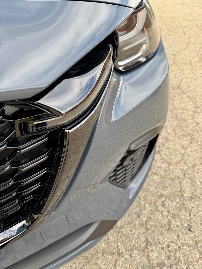 Close-up of the Mazda CX-70 front bumper and headlight protected with XPEL Ultimate Plus paint protection film.