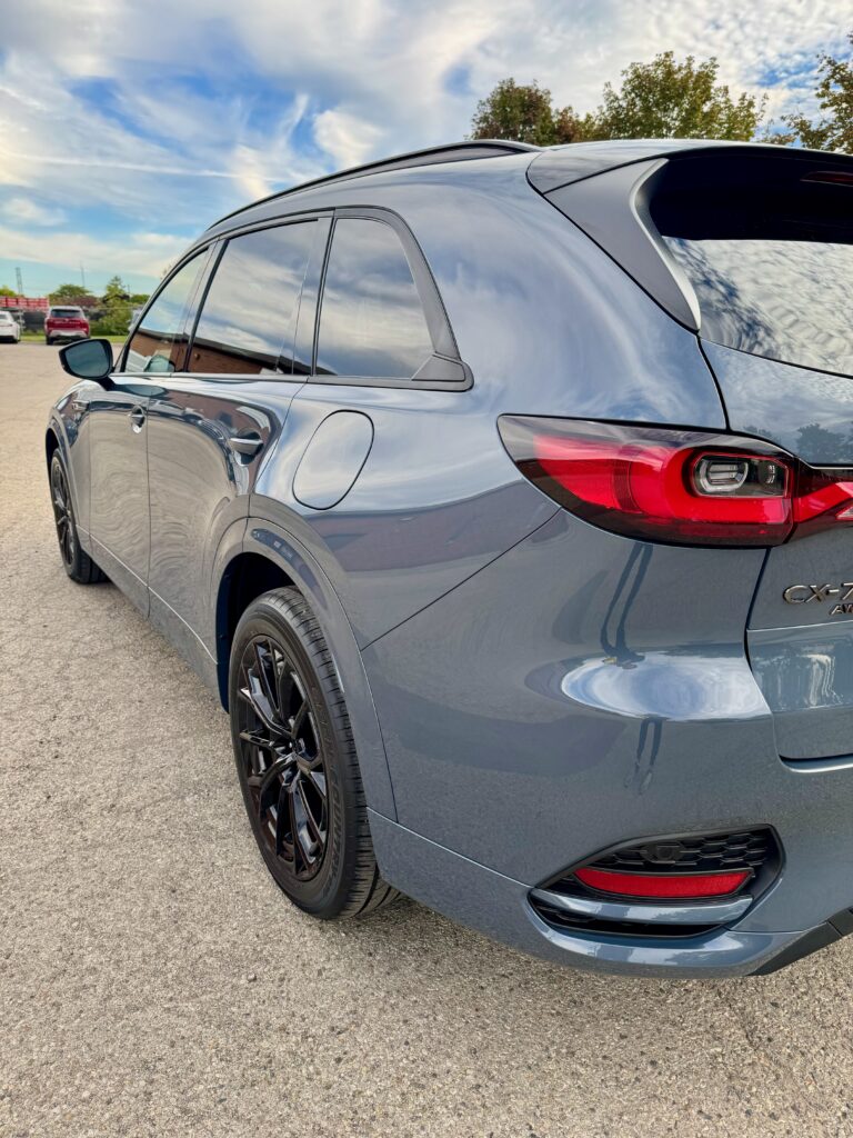 Rear three-quarter view of a grey Mazda CX-70 after Gtechniq CSL ceramic coating, showing the paint finish and black wheels.