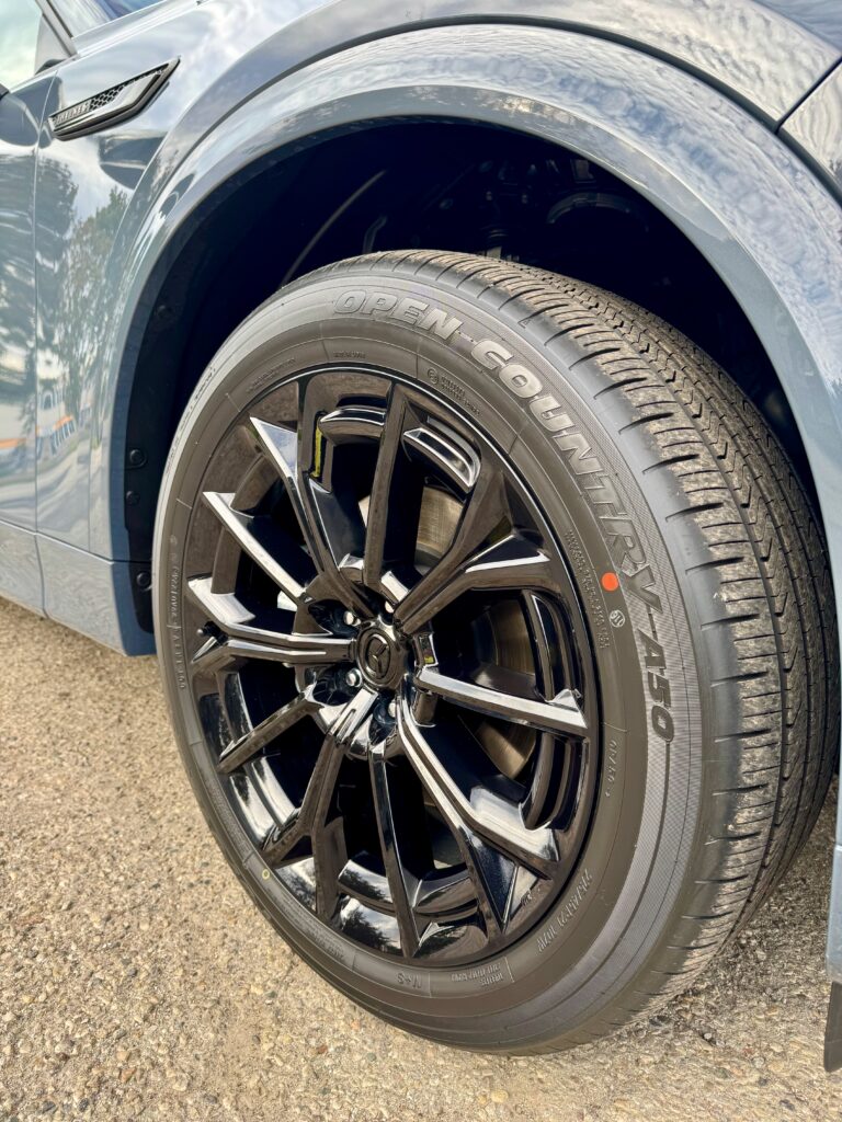 Close-up of a black Mazda CX-70 alloy wheel after Gtechniq C5 Wheel Armour application.