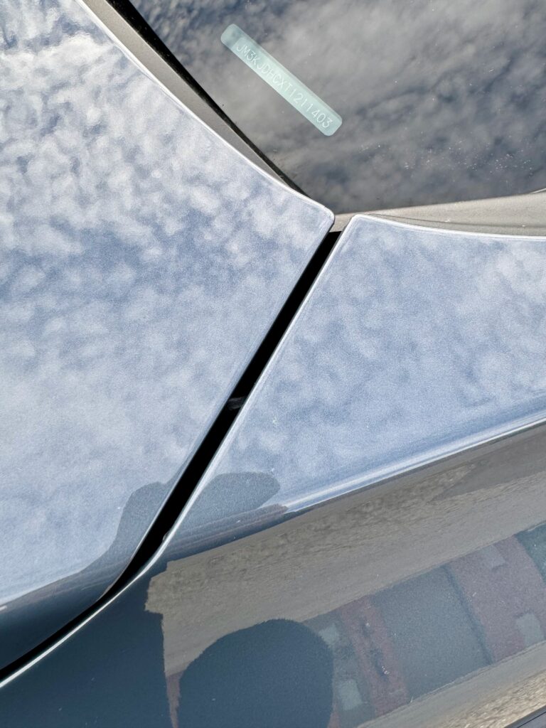 Close-up of the Mazda CX-70 A-pillar and roof edge protected with XPEL Ultimate Plus paint protection film.