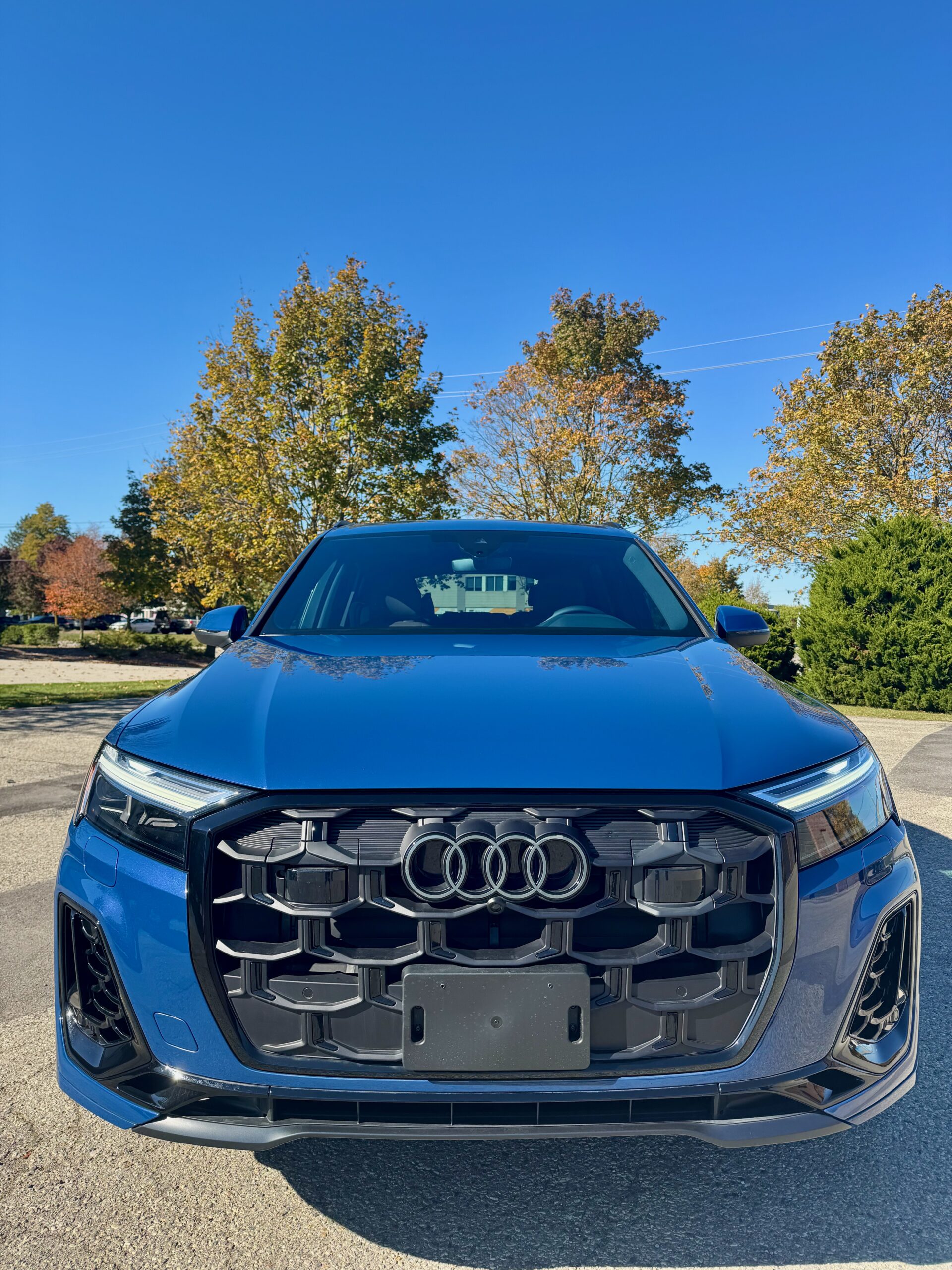 Front view of blue Audi Q7 after XPEL ULTIMATE PLUS full front paint protection film installation